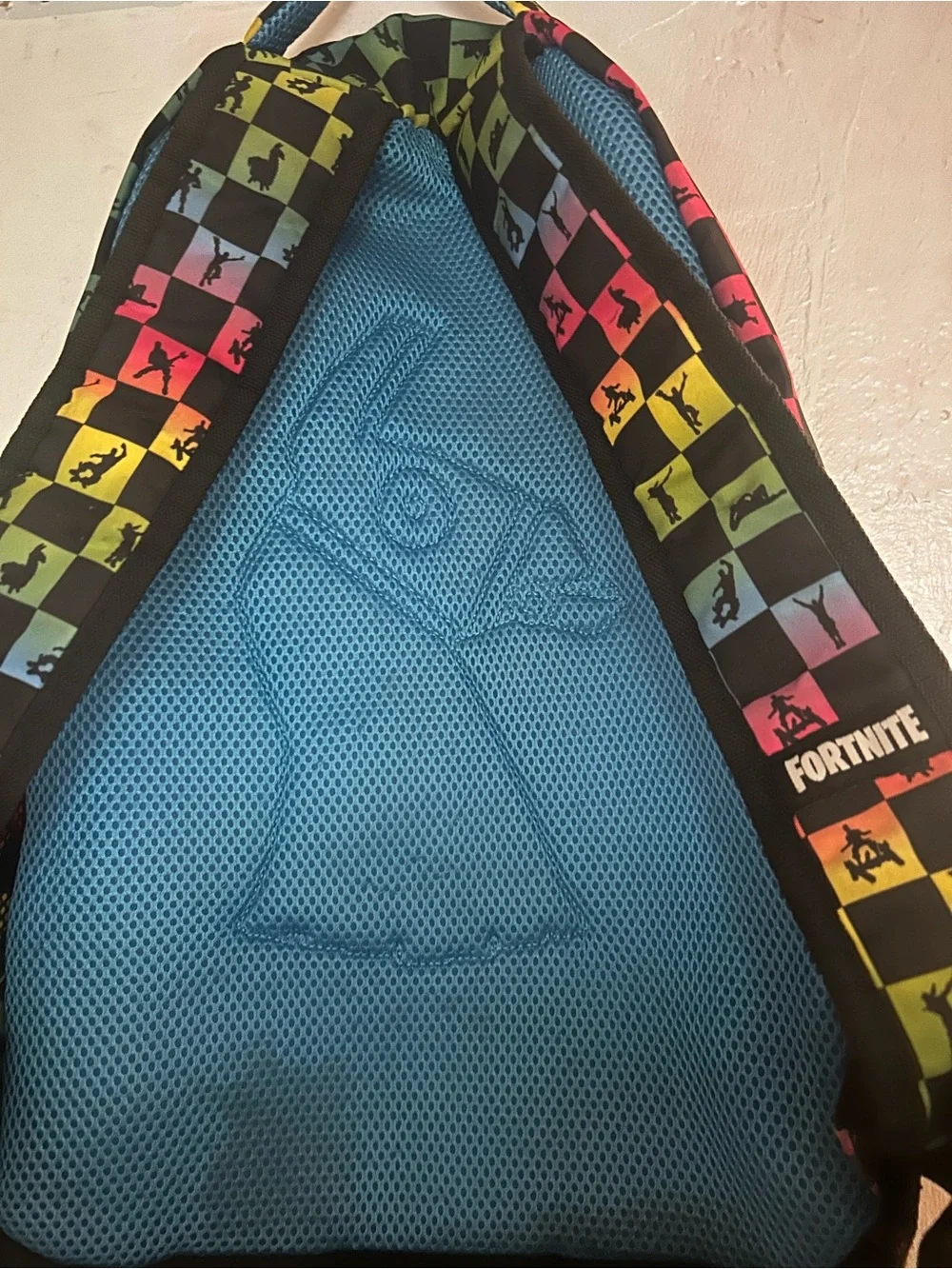 Black Backpack with Rainbow Checkerboard Pattern